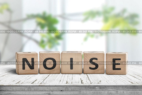 Noise sign made of wood in a bright room with green plants in daylight. Стоковое фото, агентство Ingram Publishing / Фотобанк Лори