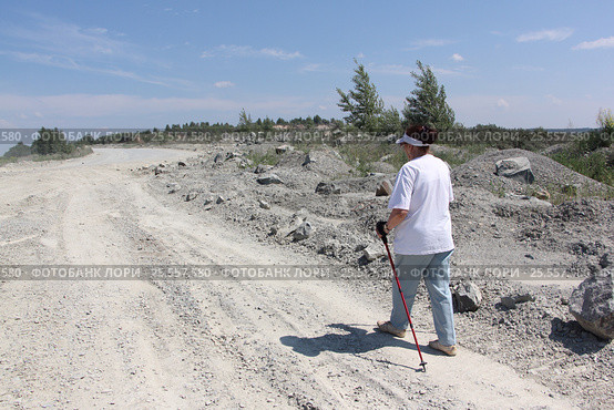Nordic Walking - elderly woman is hiking in the summer. Стоковое фото, фотограф Наталия Макарова / Фотобанк Лори