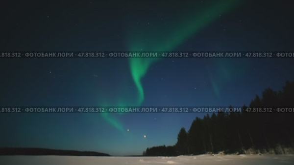 Northern Lights Time lapse 4K video, polar light or Aurora Borealis in the dark winter night sky over the arctic landscape. Стоковое видео, видеограф Николай Евсюков / Фотобанк Лори