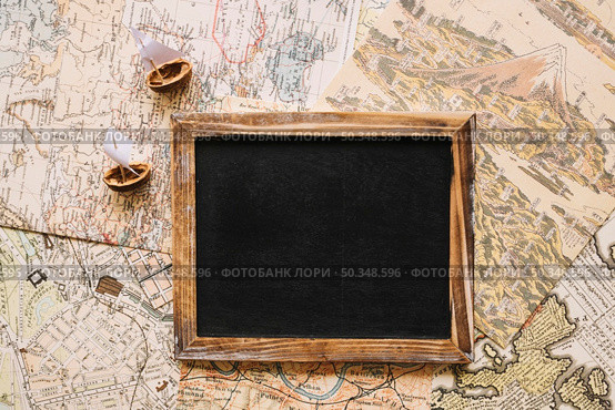 nutshell boats near blackboard. Стоковое фото, агентство Ingram Publishing / Фотобанк Лори