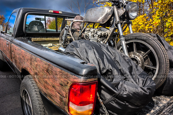 Old motorcycle in the back of an old pickup truck on a forest road. Стоковое фото, фотограф Iva Noel / Фотобанк Лори