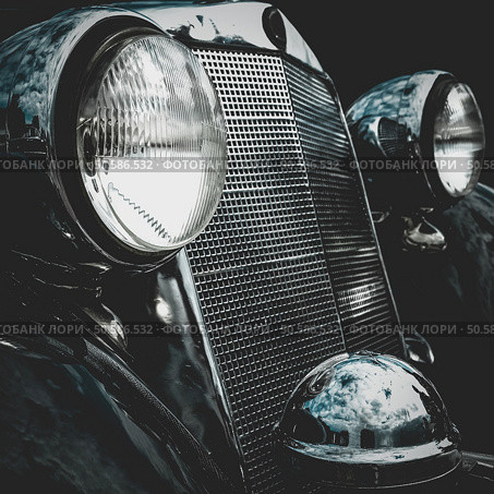 Old retro or vintage car or automobile front side with front lights or headlights and radiator grill. Processed by vintage or retro effect filter. Old retro or vintage car front side. Vintage effect processing. Стоковое фото, агентство Ingram Publishing / Фотобанк Лори