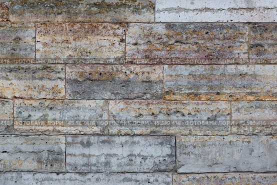 Old wall lined with decorative stone. Weathered rough surface of stones. Beautiful masonry in a classic style. Vintage texture great for background and design. Стоковое фото, фотограф Андрей Степанов / Фотобанк Лори