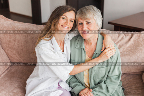 Older mature mother and grown millennial daughter laughing embracing, caring smiling young woman embracing happy senior middle aged mom. Стоковое фото, фотограф Гладских Татьяна / Фотобанк Лори