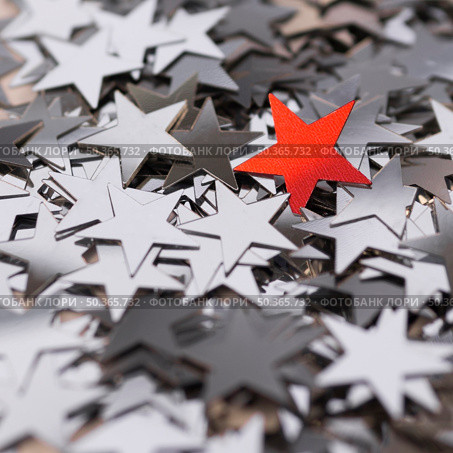 OLYMPUS DIGITAL CAMERA. collection silver stars surrounding red one. Стоковое фото, агентство Ingram Publishing / Фотобанк Лори