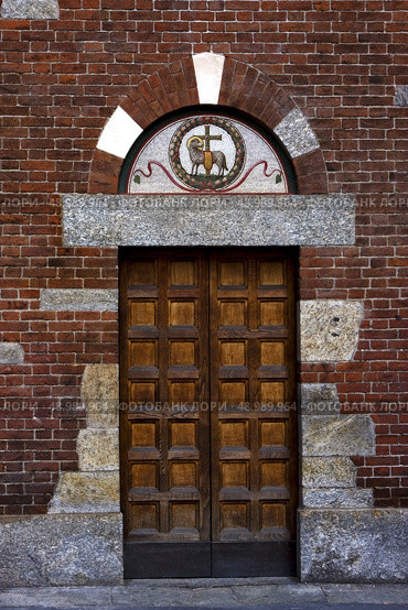 one of the door in the church of san babila in milan. Стоковое фото, агентство Ingram Publishing / Фотобанк Лори