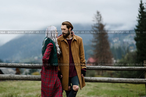 pair of lovers in the Carpathian mountains in national costumes. Стоковое фото, агентство Ingram Publishing / Фотобанк Лори