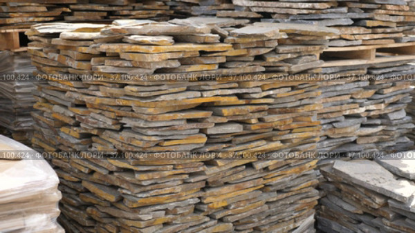 Pallets with stack of natural stone blocks lying at warehouse of building materials. Стоковое видео, видеограф Яков Филимонов / Фотобанк Лори
