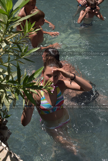 Pammukale, Turkey - July, 19, 2015: People in antique Cleopatra's pool with thermal water in ancient city Hierapolis, near modern Turkey city Denizli. Редакционное фото, фотограф Анна Кривицкая / Фотобанк Лори