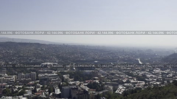 Panorama of the city center from the highest Mtatsminda mountain. Tbilisi. Georgia. 04.09.23 (2024 год). Редакционное видео, видеограф Ярославский Максим / Фотобанк Лори