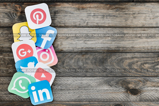 paper cut outs applications icons old wooden background. Стоковое фото, агентство Ingram Publishing / Фотобанк Лори