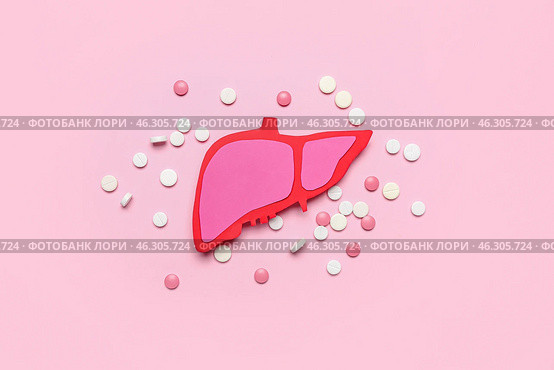 Paper liver with pills on pink background. Стоковое фото, фотограф Pixel_shot / Фотобанк Лори