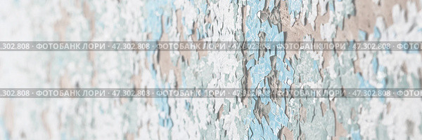 Peeling paint on the wall. Old concrete wall with cracked flaking paint. Weathered rough painted surface with patterns of cracks and peeling. Grunge texture for background and design. High resolution. Стоковое фото, фотограф Андрей Степанов / Фотобанк Лори