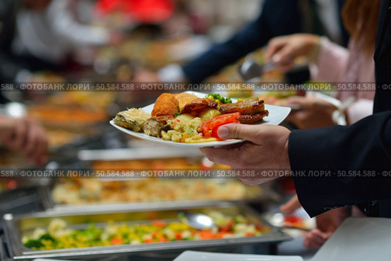 people group catering buffet food indoor in luxury restaurant with meat colorful fruits  and vegetables. Стоковое фото, агентство Ingram Publishing / Фотобанк Лори