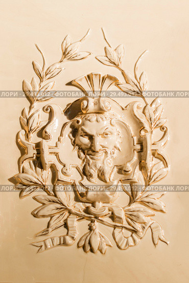 Perm, Russia - November 24, 2018: tiled panel with a bas-relief on an old fireplace of the XIX century. Редакционное фото, фотограф Евгений Харитонов / Фотобанк Лори