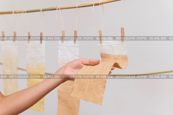 person placing pigmented cloths dry. Стоковое фото, агентство Ingram Publishing / Фотобанк Лори