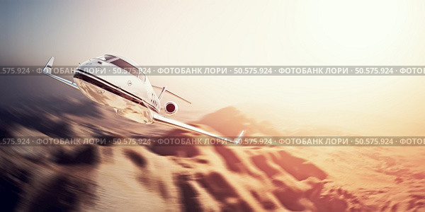 Photo of white modern and luxury generic design private jet flying in blue sky over uninhabited desert.Mountains background.Business travel concept. Horizontal,motion blurred effect.. Photo of white modern and luxury generic design private jet flying in blue sky over uninhabited desert.Mountains background.Business travel concept. Horizontal,motion blurred effect. 3d rendering. Стоковое фото, агентство Ingram Publishing / Фотобанк Лори
