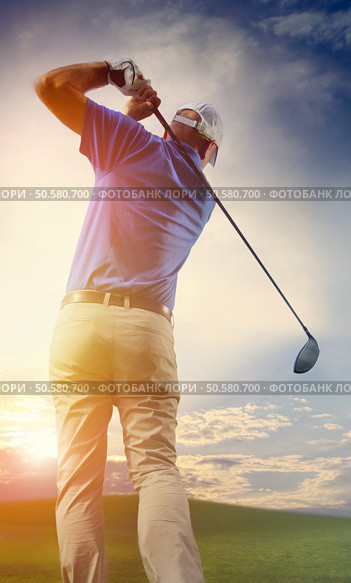 	Photograph of a golfer finishing a full swing. Стоковое фото, агентство Ingram Publishing / Фотобанк Лори
