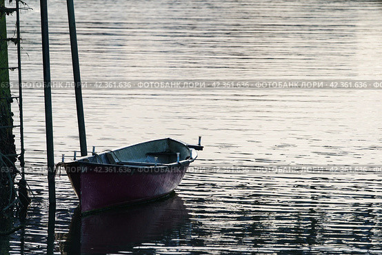 Photography of lonely boat near the pier. Стоковое фото, фотограф YuryKara / Фотобанк Лори