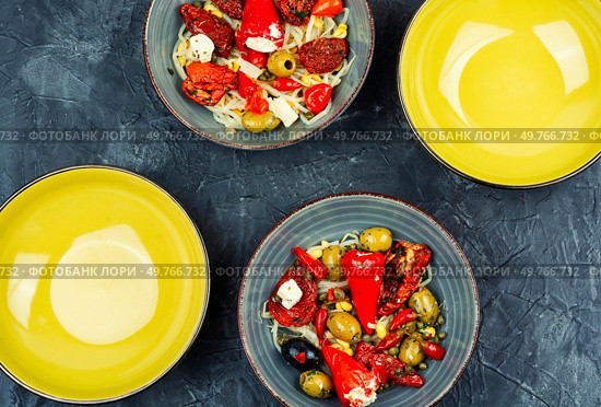 Pickled soya bean salad with pickled soybean sprouts, dried tomatoes, olives and peppers. Korean Food. Top view.. Salad of preserved soy sprouts and pickled vegetables. Стоковое фото, агентство Ingram Publishing / Фотобанк Лори