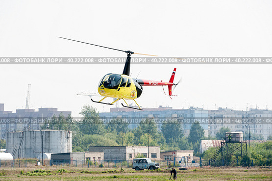 Piloting of Robinson R44 Raven on airshow (2012 год). Редакционное фото, фотограф Сергей Буторин / Фотобанк Лори