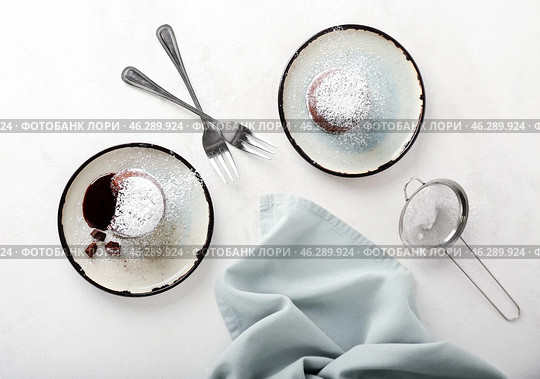 Plates with tasty lava cake fondant on white background. Стоковое фото, фотограф Pixel_shot / Фотобанк Лори
