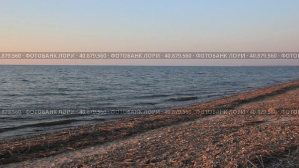 Побережье Азовского моря в лучах заходящего солнца. Стоковое видео, видеограф Олег Хархан / Фотобанк Лори