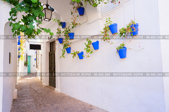 Poble Espanyol street, with traditional for Andalusia white walls architecture, Barcelona, Catalonia Spain. Poble Espanyol, Barcelona. Стоковое фото, агентство Ingram Publishing / Фотобанк Лори
