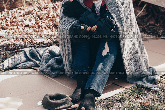Poor homeless woman begging for help outdoors. Стоковое фото, фотограф Pixel_shot / Фотобанк Лори