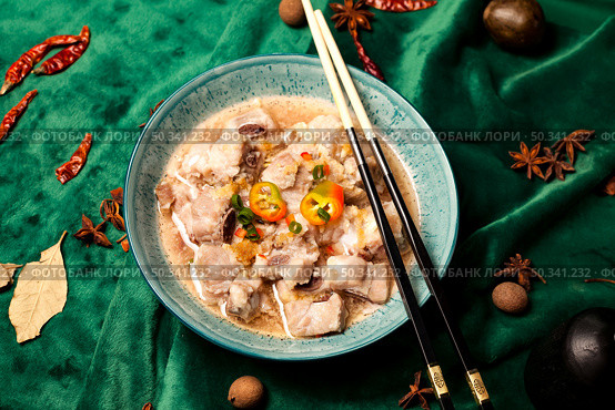 Pork Ribs Soup Served With Chopsticks on a Green Velvet Tablecloth. Стоковое фото, фотограф Aleksandr Golubev / Фотобанк Лори