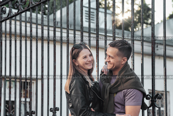 Portrait happy couple, woman and man together outdoors, spending time, laugh. Smiling caucasian couple walking enjoy leisure activity in park. Concept of good family relationship. Copy text space. Стоковое фото, фотограф Aleksandr Golubev / Фотобанк Лори