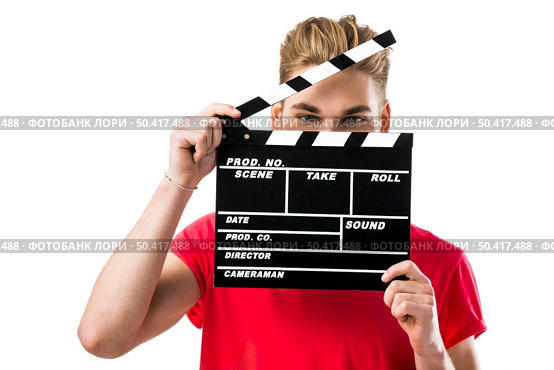 Portrait of a handsome young man wolding a clapboard. Стоковое фото, агентство Ingram Publishing / Фотобанк Лори