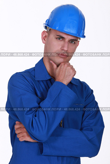 Portrait of a pensive tradesman. Стоковое фото, агентство Ingram Publishing / Фотобанк Лори
