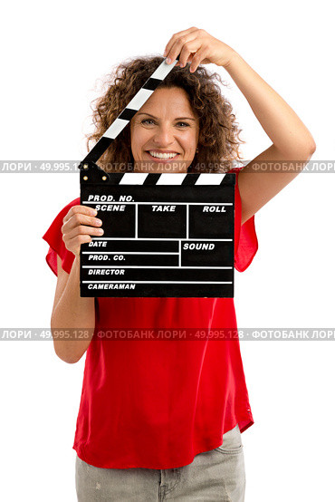 Portrait of a smiling middle aged brunette holding a clapboard. Стоковое фото, агентство Ingram Publishing / Фотобанк Лори