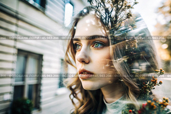 Portrait of a young woman. Conceptual artistic close-up image against the background of a city with double exposure and visual effects. An advertising move. Стоковое AI-изображение, AI-художник Photojuli / Фотобанк Лори