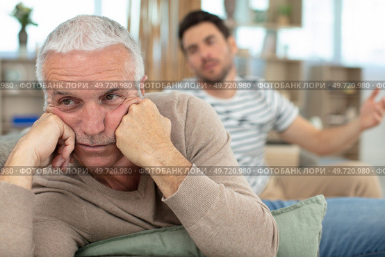 portrait of aging grieving man with his son. Стоковое фото, агентство Ingram Publishing / Фотобанк Лори
