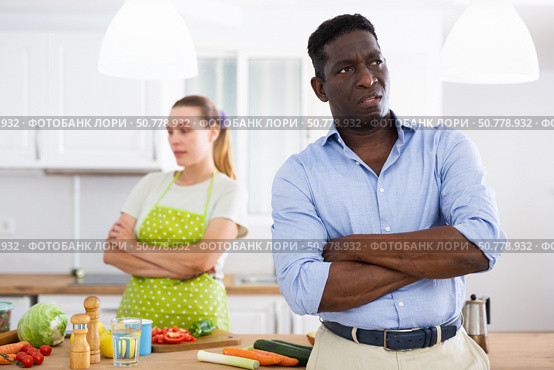 Portrait of man having quarrel with his wife in kitchen. Стоковое фото, фотограф Татьяна Яцевич / Фотобанк Лори