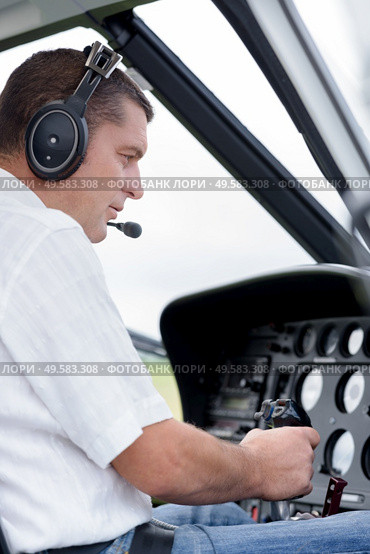 portrait of pilot in helicopter. Стоковое фото, агентство Ingram Publishing / Фотобанк Лори