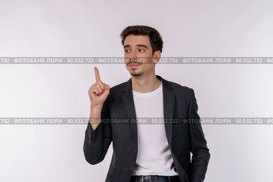 Portrait of thinking man surrounded by question mark on isolated background. Finding inspiration or solution to problem. Стоковое фото, агентство Ingram Publishing / Фотобанк Лори