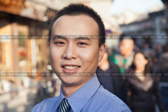Portrait of young business man in Houhai, Beijing, China. Стоковое фото, агентство Ingram Publishing / Фотобанк Лори