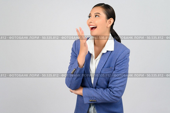 Portrait young beautiful woman in formal clothing for officer standing laugh and exciting, isolated on white background,  copy space for insert your advertisement. Стоковое фото, агентство Ingram Publishing / Фотобанк Лори