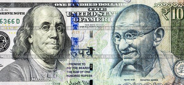 Portraits of Benjamin Franklin on banknote american dollars and Mahatma  Gandhi on Indian rupees. Business concept. Стоковое фото, фотограф FotograFF / Фотобанк Лори