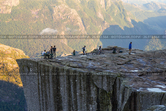 Preikestolen or Prekestolen or Preacher's Pulpit or Pulpit Rock, is a famous tourist attraction in Forsand, Ryfylke, Norway (2017 год). Редакционное фото, фотограф Алексей Ширманов / Фотобанк Лори