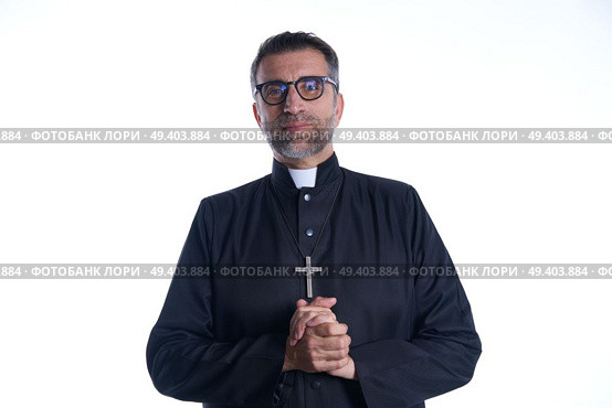 Priest pastor portrait praying hands relaxed. Стоковое фото, агентство Ingram Publishing / Фотобанк Лори