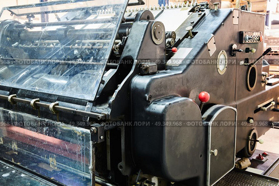 Printer lithography cylinder machine printing. Printer lithography cylinder machine in a printing factory. Стоковое фото, агентство Ingram Publishing / Фотобанк Лори