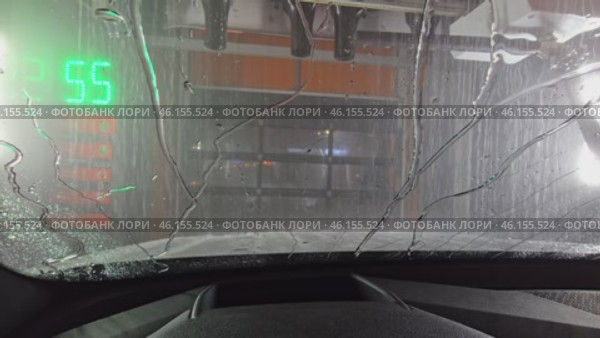 Process of applying wax. Robotic hand carefully distributes liquid wax over entire surface of car. Wax is quickly absorbed, forming thin, but strong protective layer. Glare of light on processed. Стоковое видео, видеограф Скрипачев Антон / Фотобанк Лори