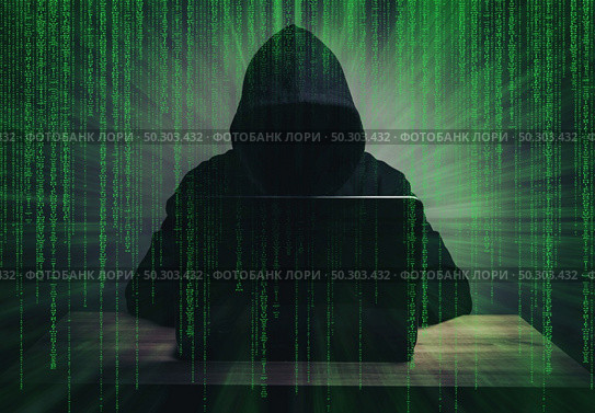 programmer hacker working on front of his laptop writing code  in the middle of night . Стоковое фото, агентство Ingram Publishing / Фотобанк Лори
