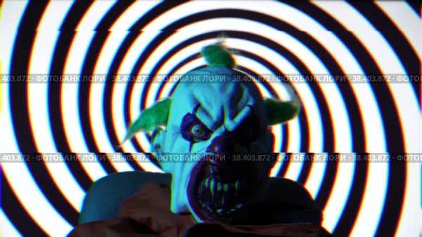 Psycho Clown against hypnotic rotating black spiral background. Стоковое видео, видеограф Mihail Mihaylov / Фотобанк Лори