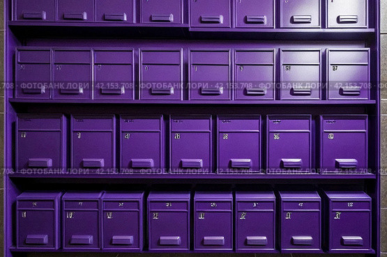 Purple steel Mailboxes in an apartment residential building inside. Modern rows of numbered mailbox, creative design mail backgrounds. Urban correspondence concept. Copy ad text space. Generated Ai. Стоковое AI-изображение, AI-художник Aleksandr Golubev / Фотобанк Лори