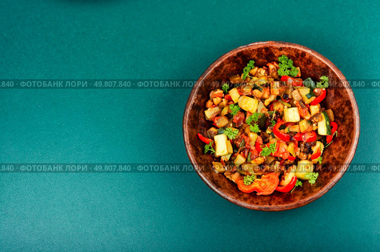 RATATOUILLE is a bright vegetable stew made from fresh fried vegetables. Space for text.. Ratatouille, vegetable dish. Стоковое фото, агентство Ingram Publishing / Фотобанк Лори